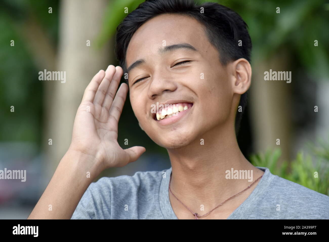 A Male Youngster And Laughter Stock Photo