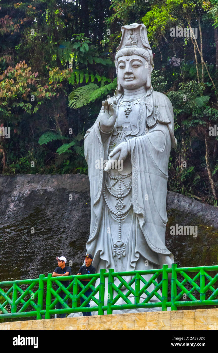 PAHANG MALAYSIA - DECEMBER 18, 2018: Beautiful giant meditating rock Buddha statue in Chin Swee caves Chinese temple, Genting highlands, Malaysia. Stock Photo