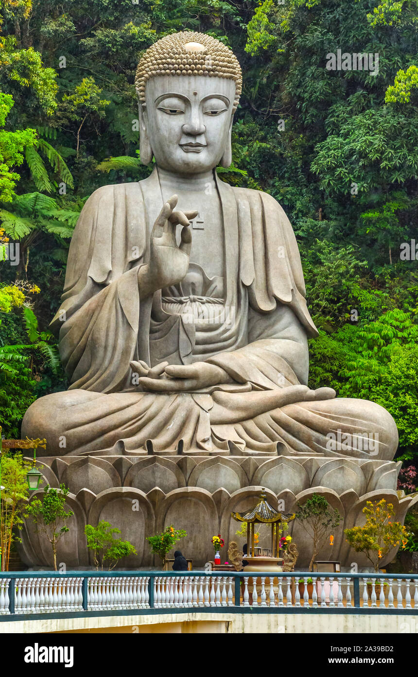 PAHANG MALAYSIA - DECEMBER 18, 2018: Beautiful giant meditating rock Buddha statue in Chin Swee caves Chinese temple, Genting highlands, Malaysia. Stock Photo