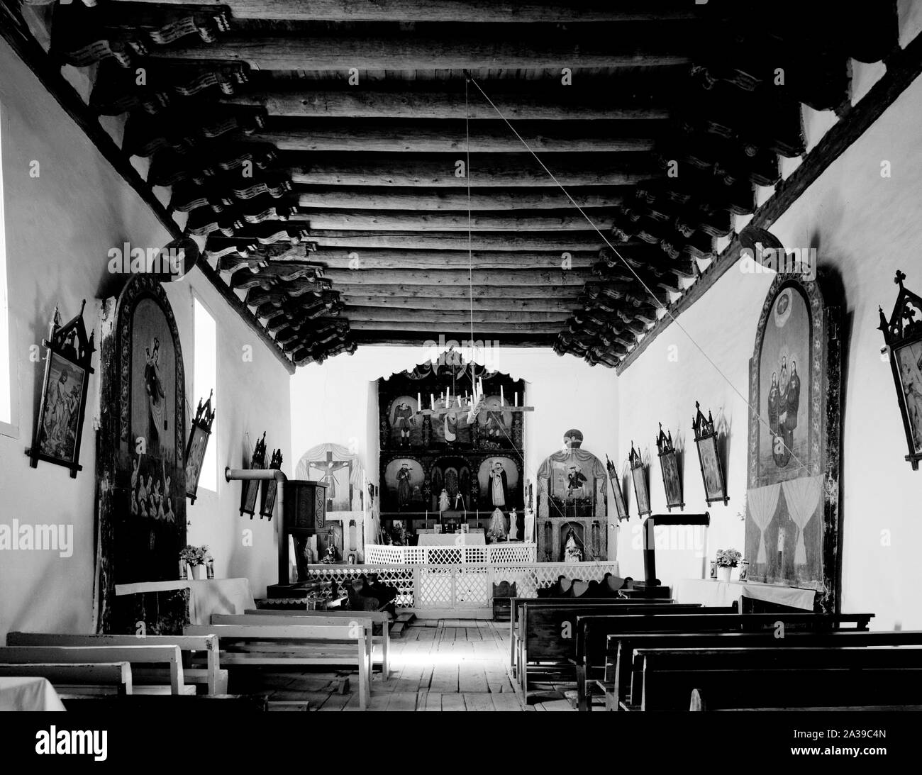 Sanctuary at the adobe San Jose de Gracia Church, built by farm families in 1751 high the Sange de Cristo Mountains, Las Trampas, New Mexico Stock Photo