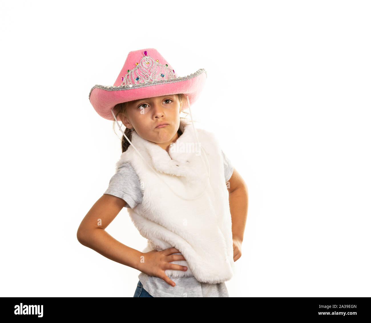 Young girl in cowboy hat posing on a white background Stock Photo - Alamy