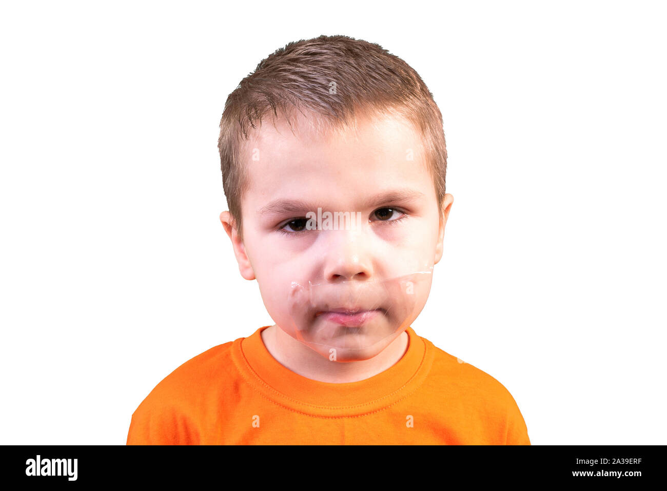 Boy with a closed mouth. Isolated on a white background. Stock Photo