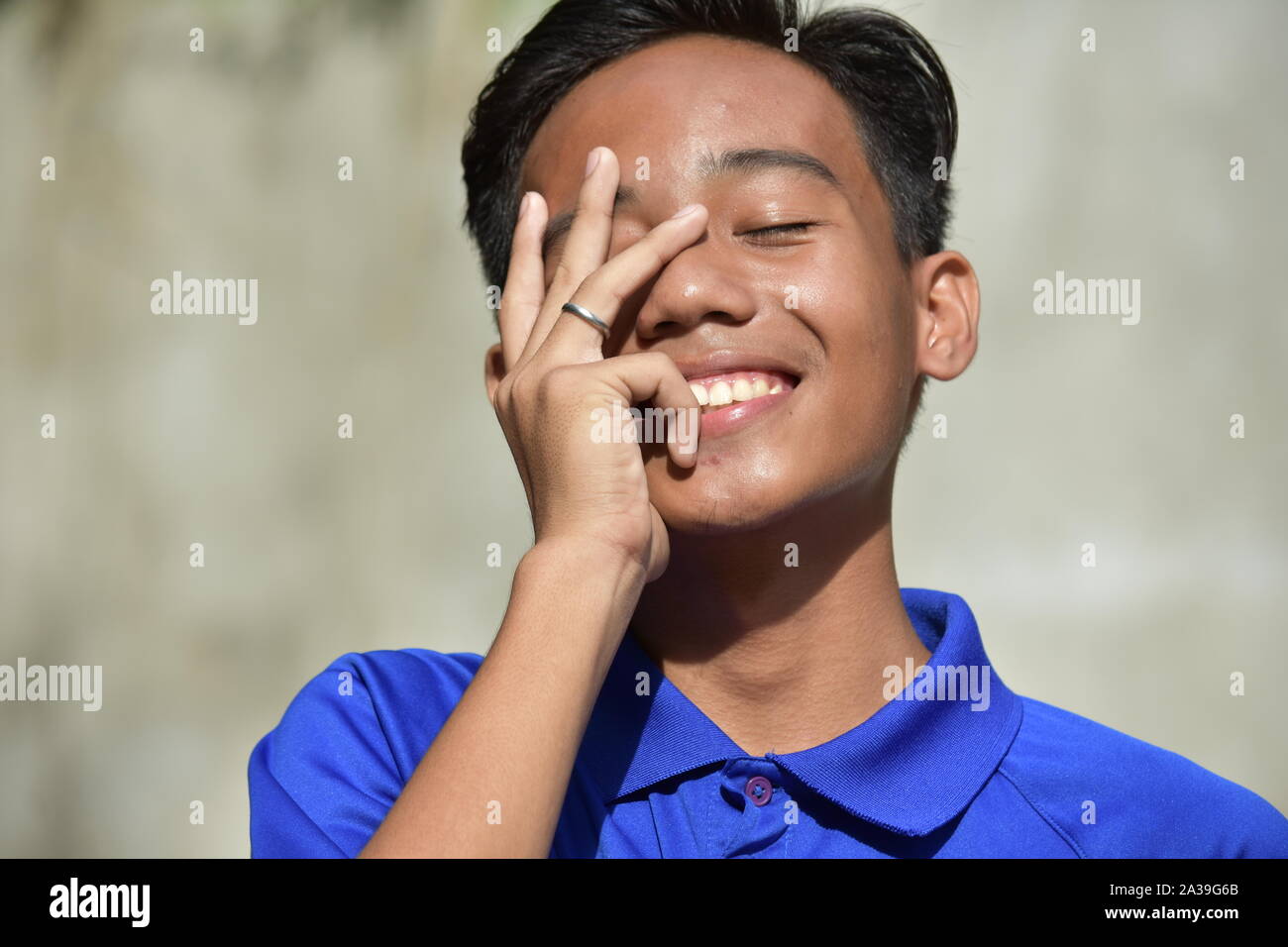 Teen boy laughing hi-res stock photography and images - Alamy