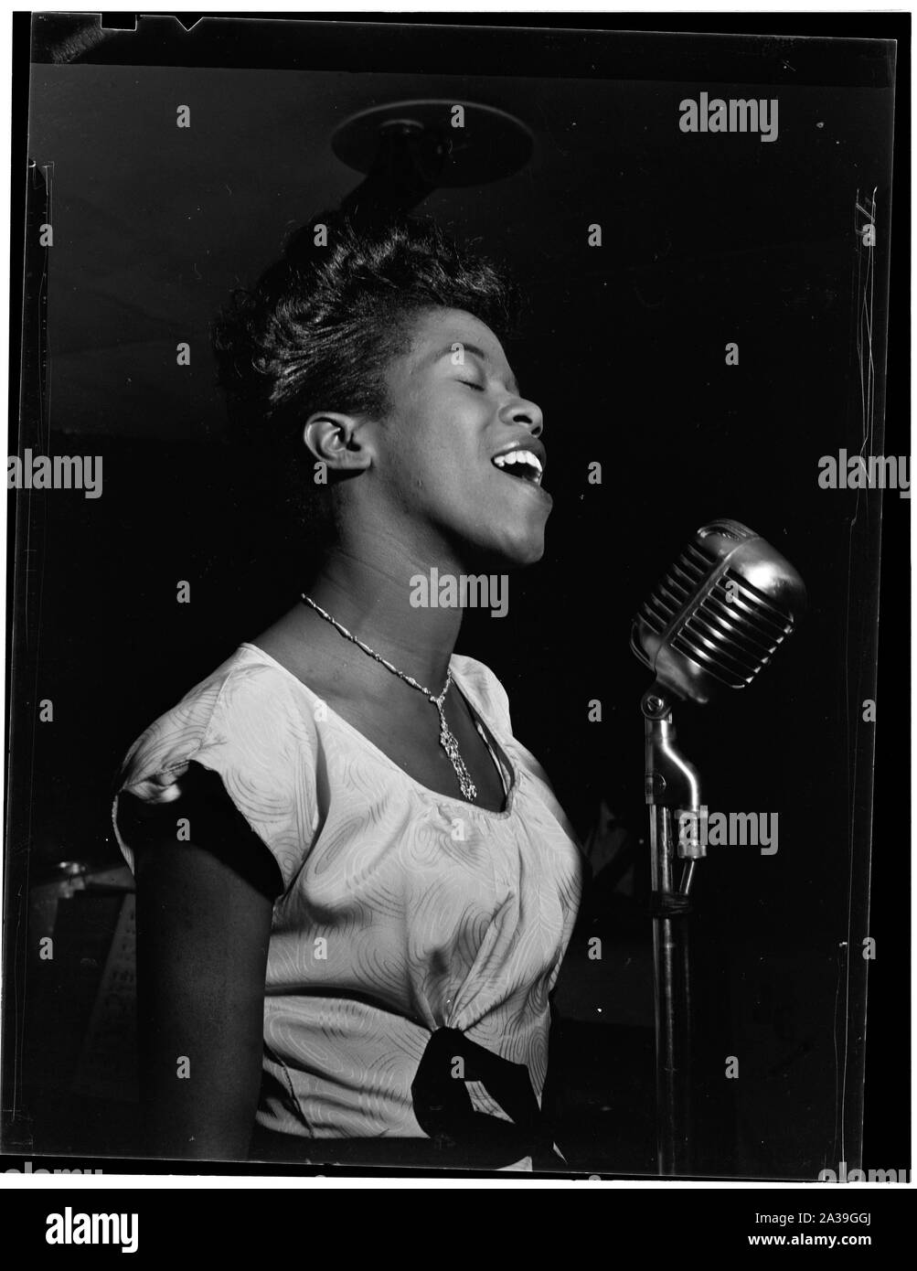 Sarah Vaughan, possibly at Cafe Society, NYC, ca. August 1946. Photography by William P. Gottlieb. Gottlieb took several photographs of Vaughan around the same time; the numbering is arbitrary.; Stock Photo