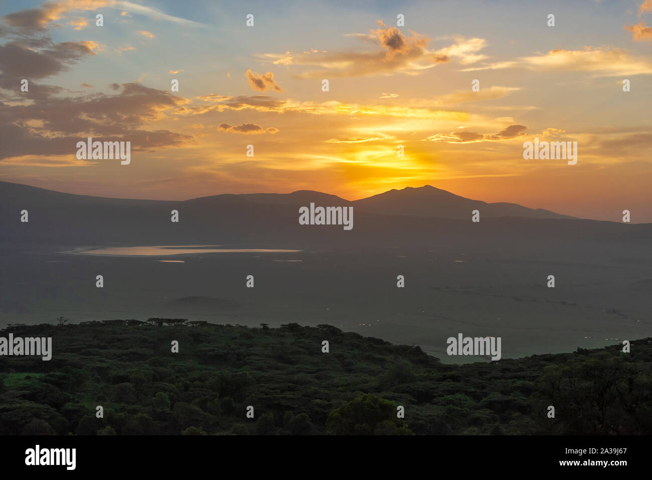 Sunrise over the Ngorongoro Caldera reflected in Lake Magadi, Tanzania Stock Photo