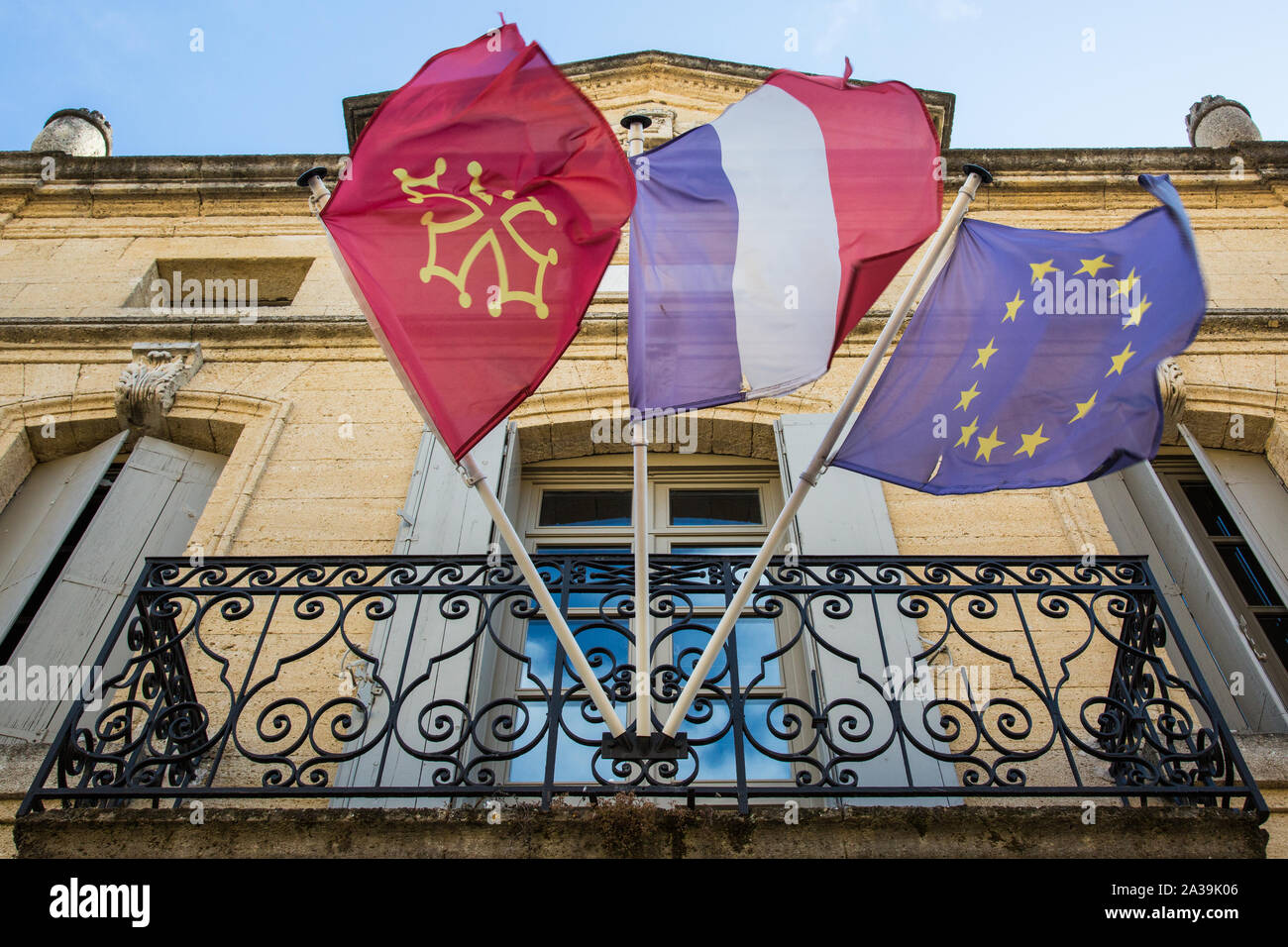Saint-Quentin-la-Potèrie, France. 21 August, 2019. The flags of the Gard department, French Republic and European Union fly outside the town hall. Cre Stock Photo