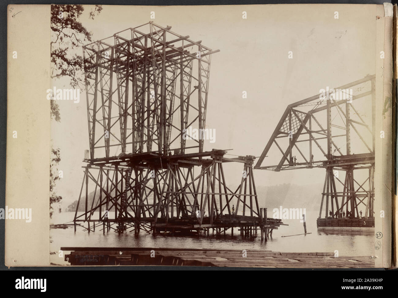 Scaffolding for construction of Hawkesbury River Railway Bridge, New South Wales, Australia, moves away from span atop timber framework on pontoon] / C. Bayliss photo, Sydney Stock Photo