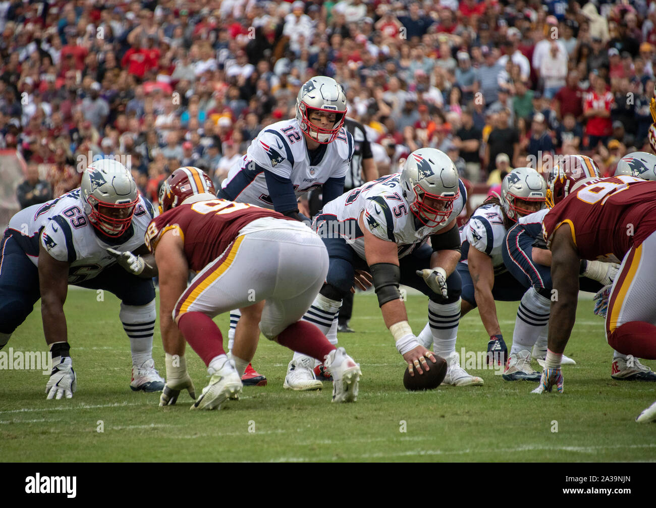 New England Patriots quarterback Tom Brady (12) calls signals during the fourth quarter of the game against the Washington Redskins at FedEx Field in Landover, Maryland on Sunday, October 6, 2019. Also pictured are New England Patriots offensive guard Shaq Mason (69), center Ted Karras (75), fullback Jakob Johnson (47), Washington Redskins defensive end Matthew Ioannidis (98) and Washington Redskins nose tackle Daron Payne (94). The Patriots won the game 33 - 7. Credit: Ron Sachs/CNP | usage worldwide Stock Photo