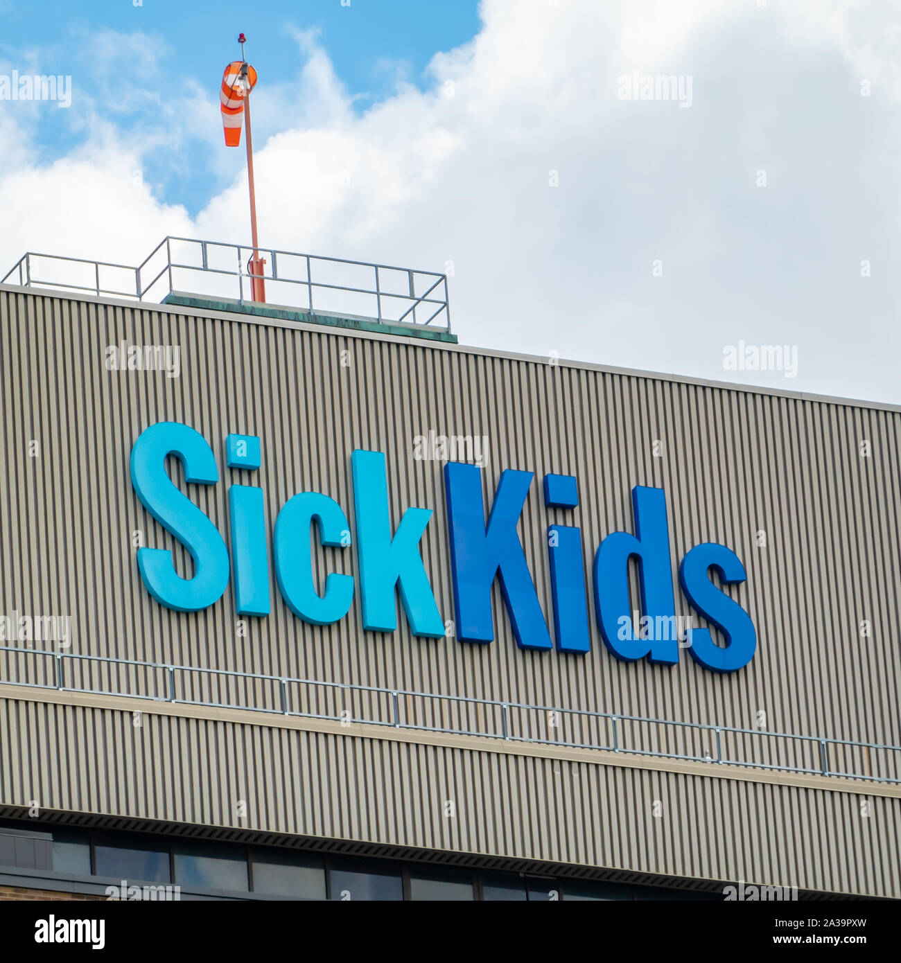 Sick Kids sign on top of the Hospital for Sick Children in downtown Toronto Ontario. Stock Photo