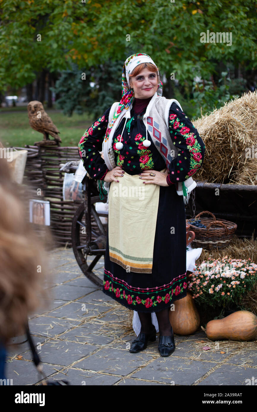 Chisinau, Moldova - October 5, 2019: Wooman in a traditional Balkan costume. Chisinau is the capital of Moldova. A holiday in the park is the central Stock Photo