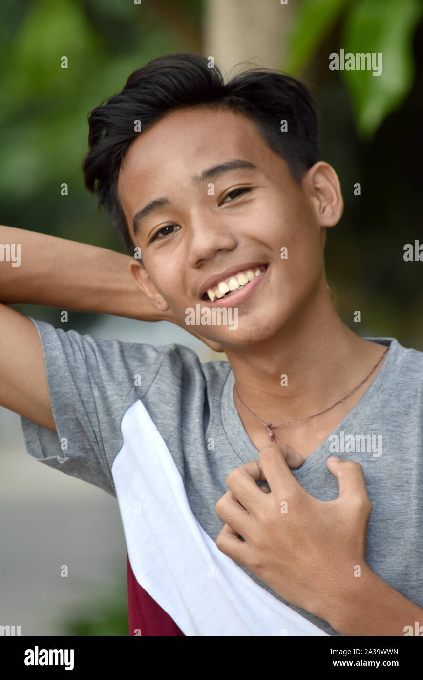 A Youthful Asian Teenager Boy Relaxing Stock Photo - Alamy