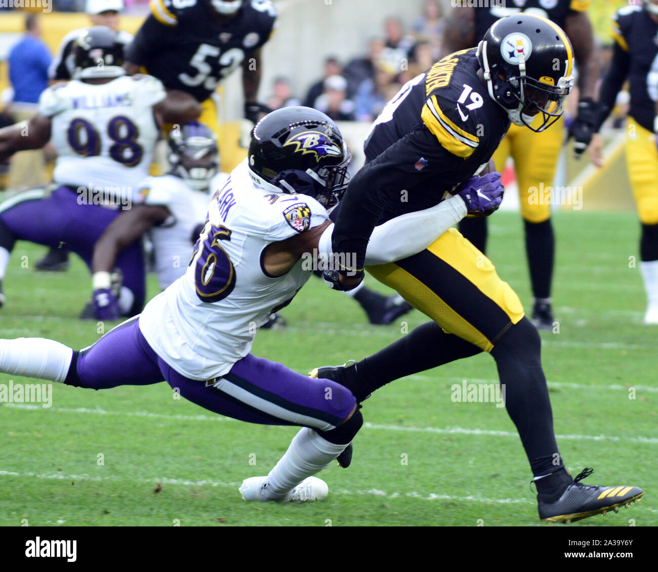 Pittsbugh, United States. 06th Oct, 2019. Baltimore Ravens defensive back Chuck Clark (36) tackles Pittsburgh Steelers wide receiver JuJu Smith-Schuster (19) after a 18 gains in the fourth quarter of the Ravens 26-23 overtime win at Heinz Field in Pittsburgh on Monday, October 6, 2019. Photo by Archie Carpenter/UPI Credit: UPI/Alamy Live News Stock Photo