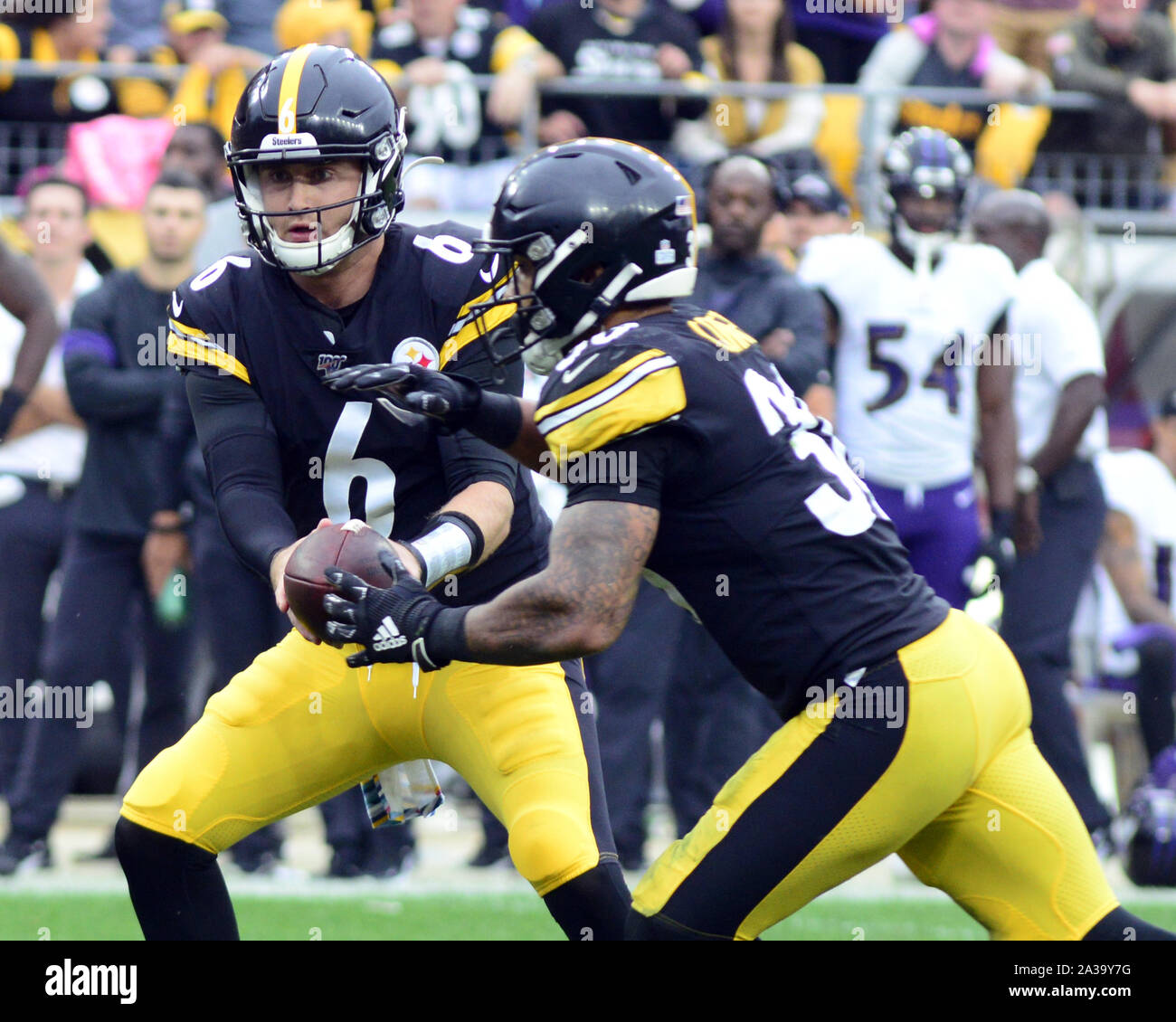 Pittsbugh, United States. 06th Oct, 2019. Pittsburgh Steelers quarterback Devlin Hodges (6) hands the football to Pittsburgh Steelers running back James Conner (30) in the fourth quarter of the 26-23 lost to the Baltimore Ravens at Heinz Field in Pittsburgh on Monday, October 6, 2019. Photo by Archie Carpenter/UPI Credit: UPI/Alamy Live News Stock Photo