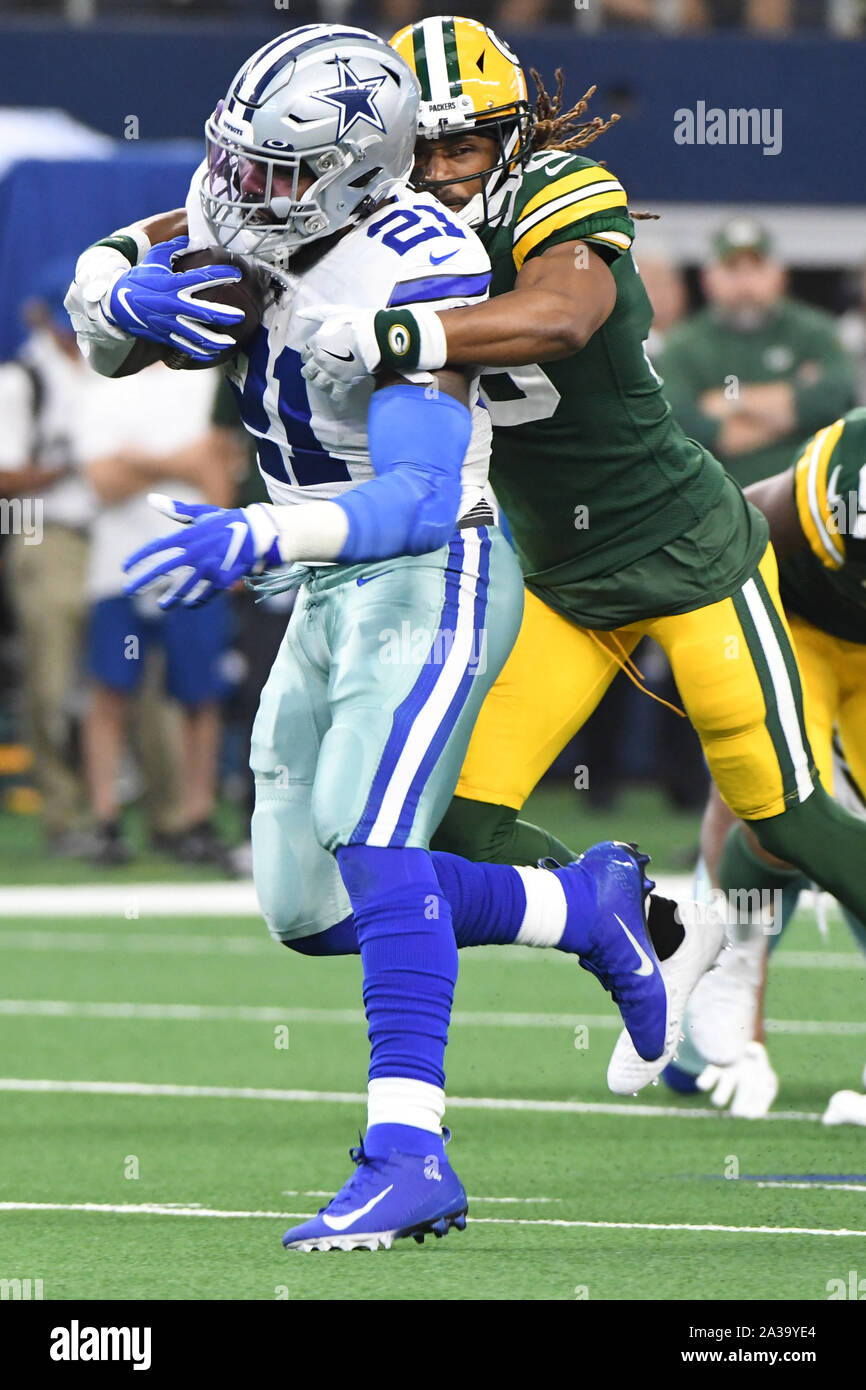 Arlington, United States. 06th Oct, 2019. Dallas Cowboys Ezekiel Ellott gets wrapped up by Green Bay Packers Tamon Williams during their NFL game AT&T Stadium in Arlington, Texas on Sunday, October 6, 2019. Photo by Ian Halperin/UPI Credit: UPI/Alamy Live News Stock Photo