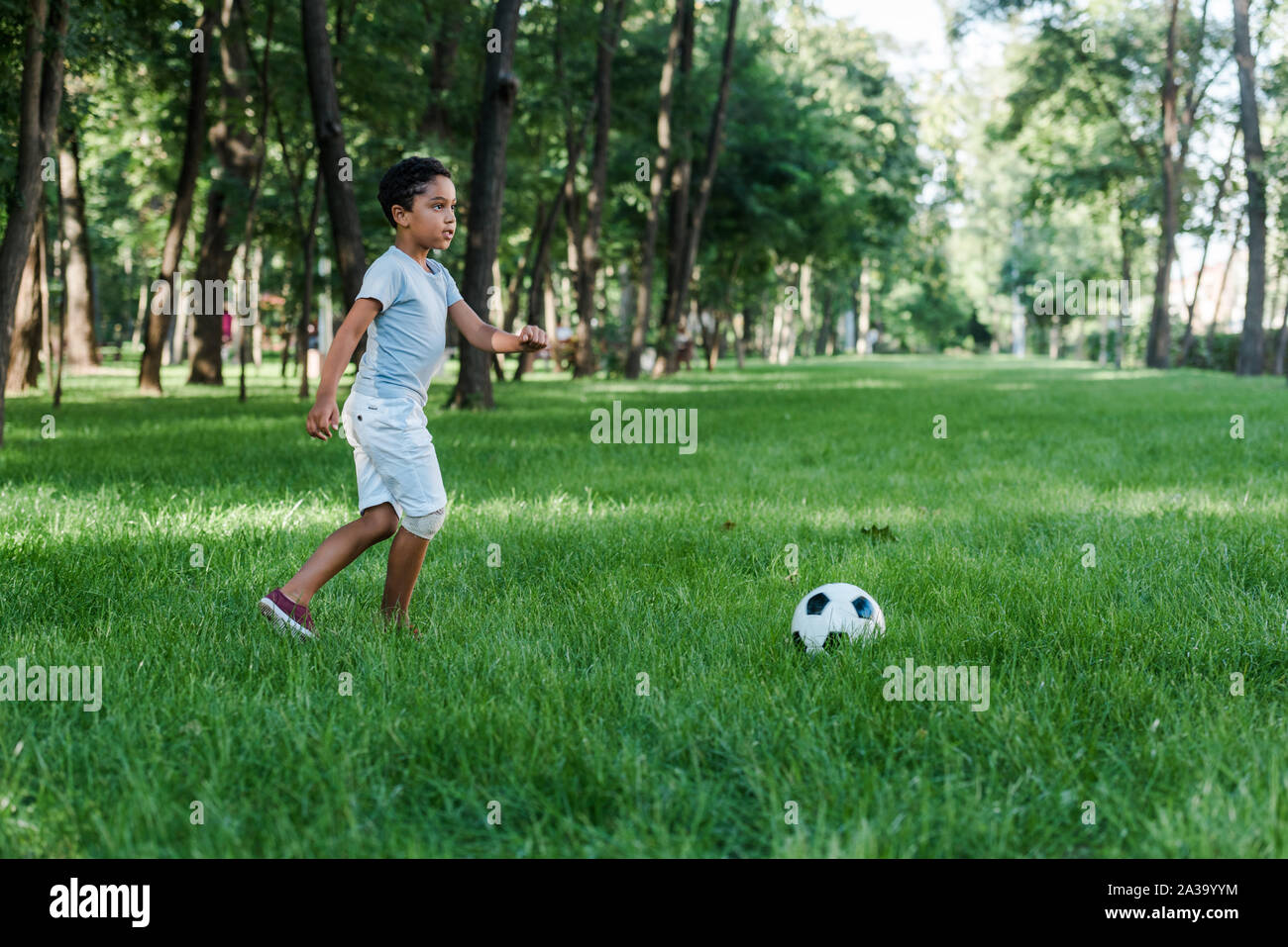 African american child football hi-res stock photography and images - Alamy