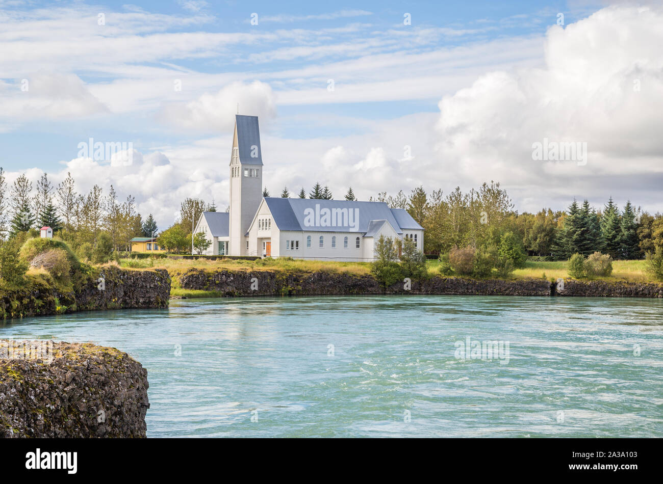 Beautiful blue river and church landscape in Iceland Stock Photo