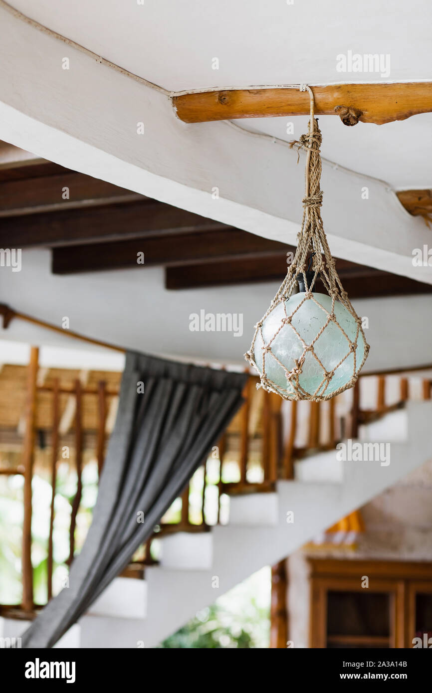 Eco friendly style interior design element. Glass lamp wrapped in craft