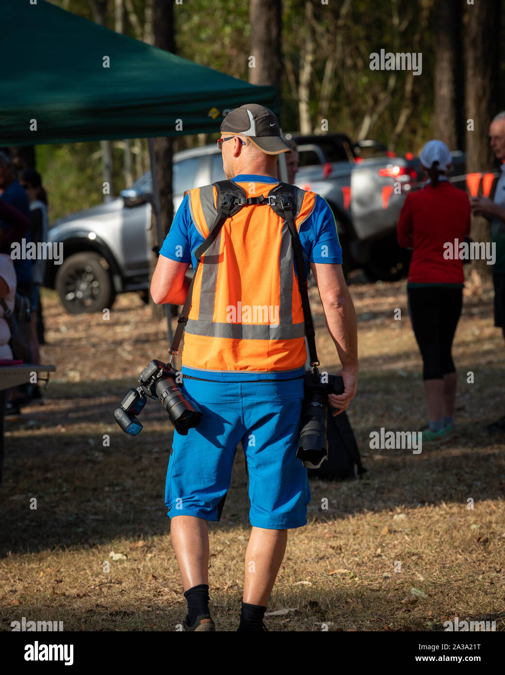 Camp Mountain, Brisbane, Queensland, Australia - Sept 15 2019: Official event photographer carrying camera gear ready to shoot photos at the Australia Stock Photo