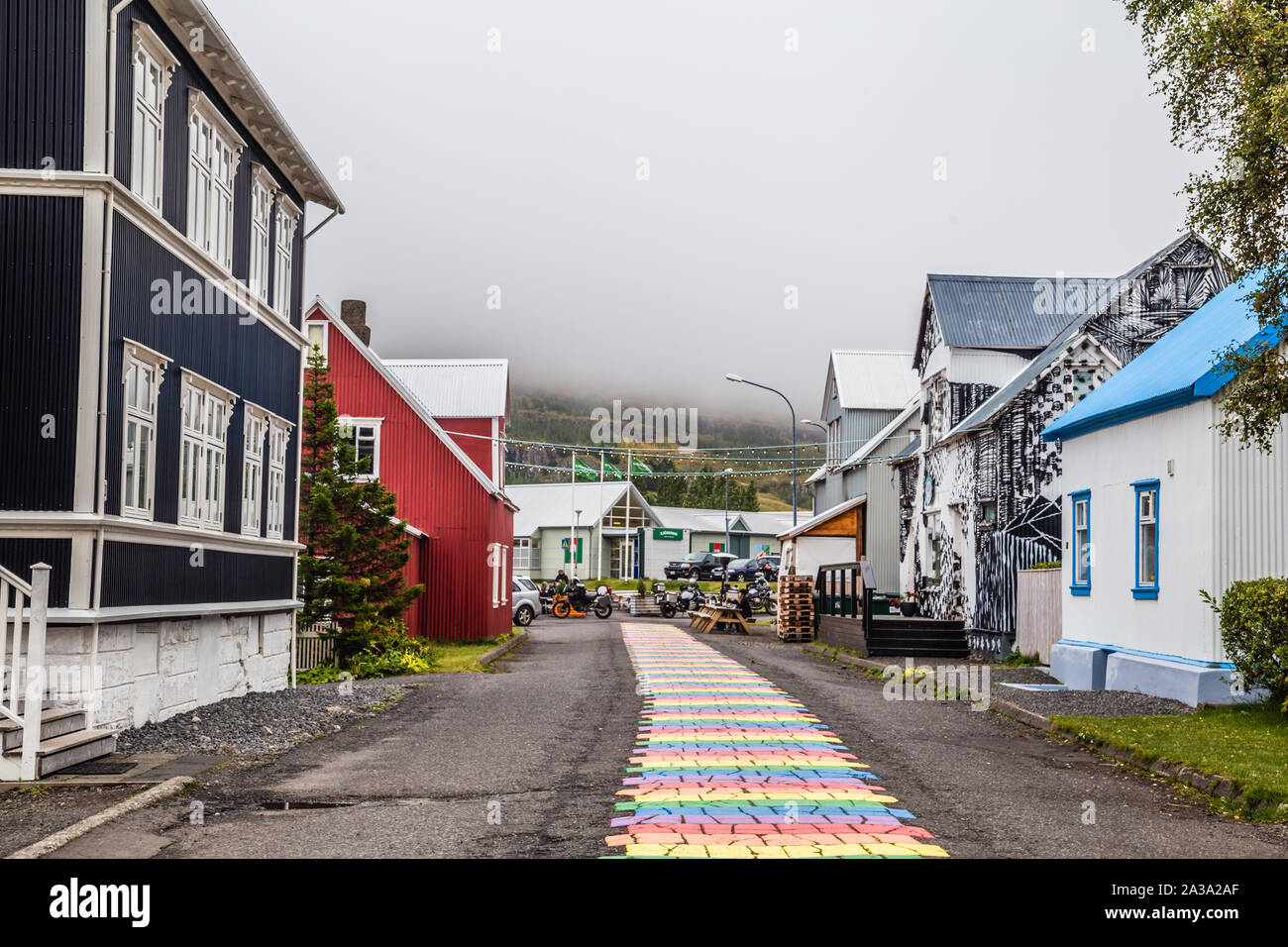 Rainbow walkway through scenic landscape in Seydisfjordir, a fishing
