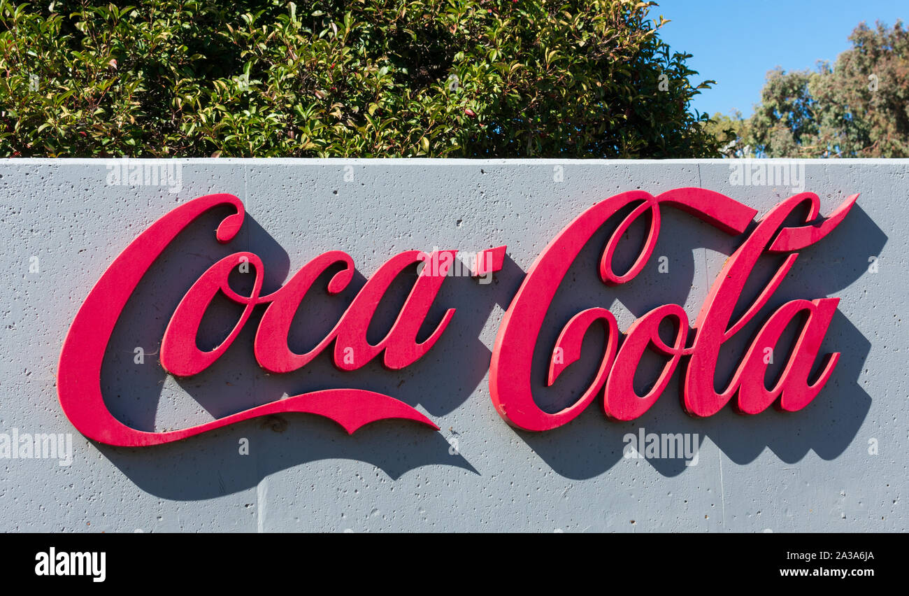 Coca Cola logo near Coca-Cola Bottling distribution service Stock Photo