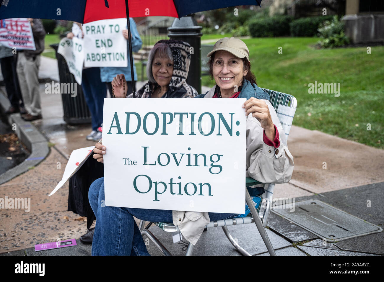 West Reading, Pennsylvania/USA – October 6, 2019: Life Chain Event: Heavy rain does not deter two senior women from participating in right to life, an Stock Photo