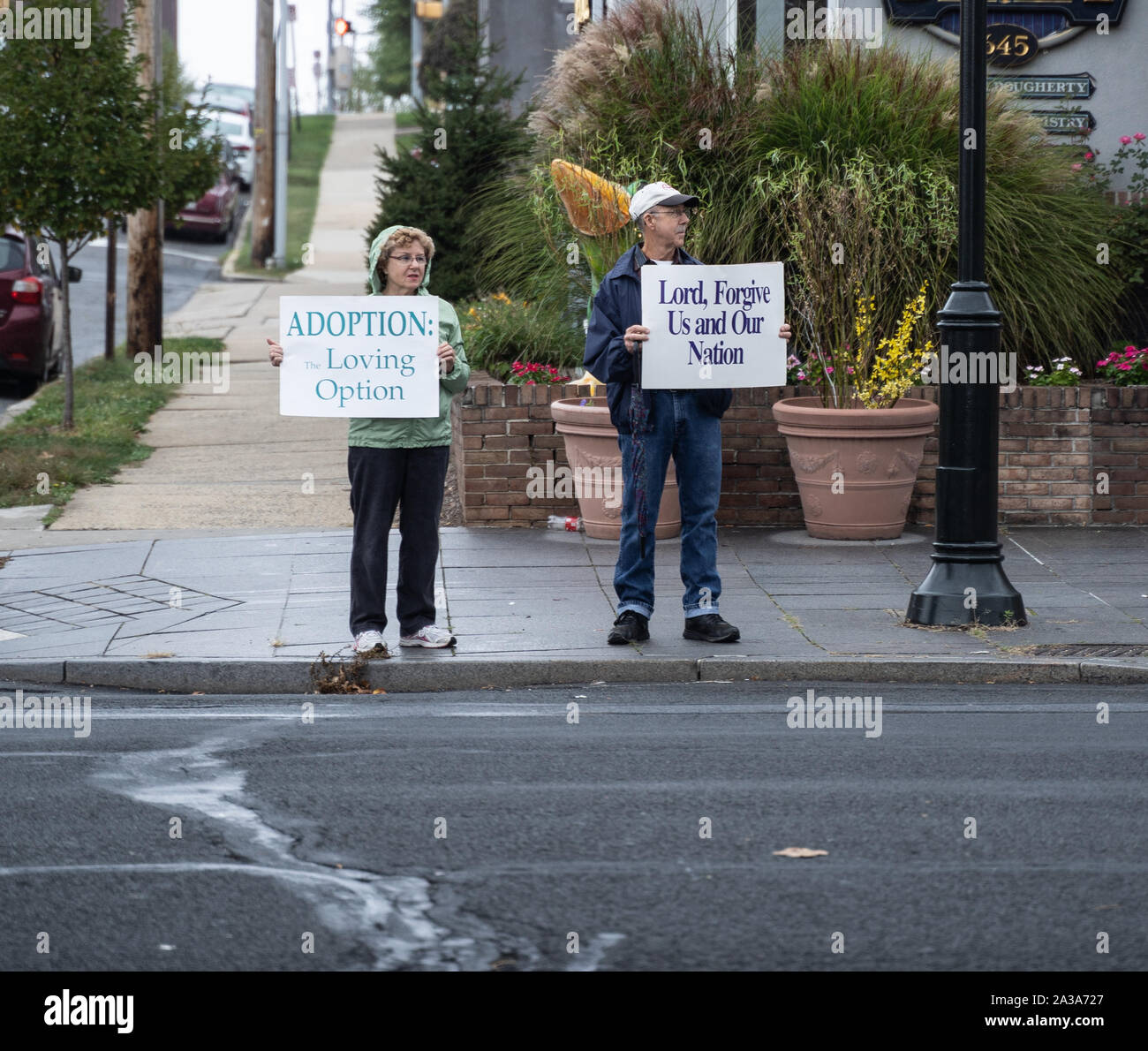 West Reading, Pennsylvania/USA – October 6, 2019: Life Chain Event: Senior couple particpates Life Chain Event, anti-abortion protest. Stock Photo