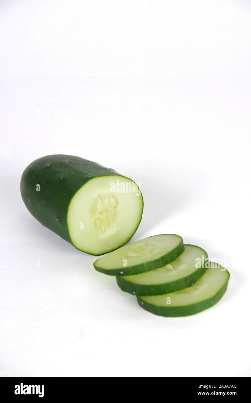 A crisp cucumber sliced up for eating. Stock Photo