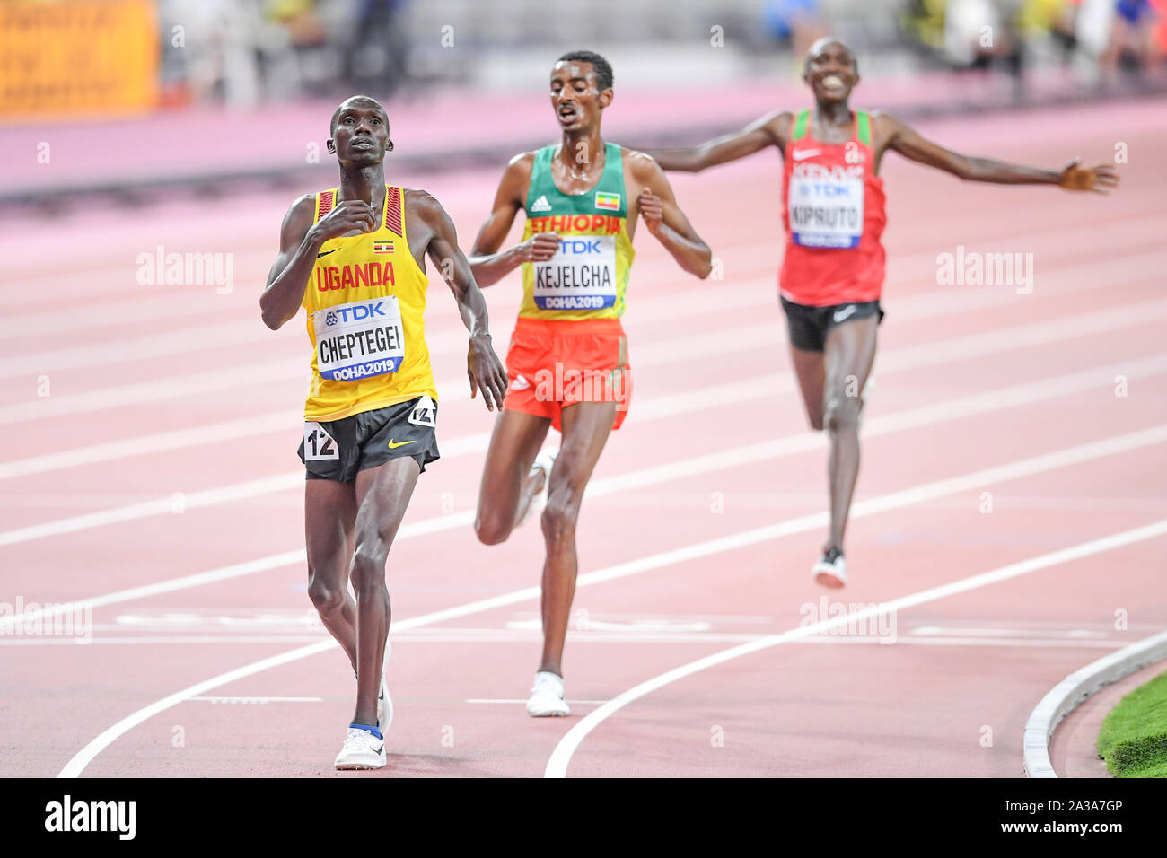 Joshua Cheptegei (Uganda, gold medal), Yomif Kejelcha (Ehtiopia, silver medal), Rhonex Kipruto (Kenya, bronze medal). 10000 Metres men final. IAAF World Athletics Championships, Doha 2019 Stock Photo