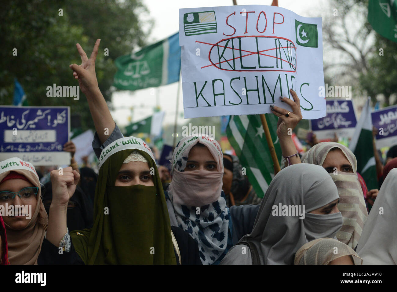 Pakistani Activists And Supporters Of The Religious Group Jamaat E Islami Hold Placards Banners And Flags