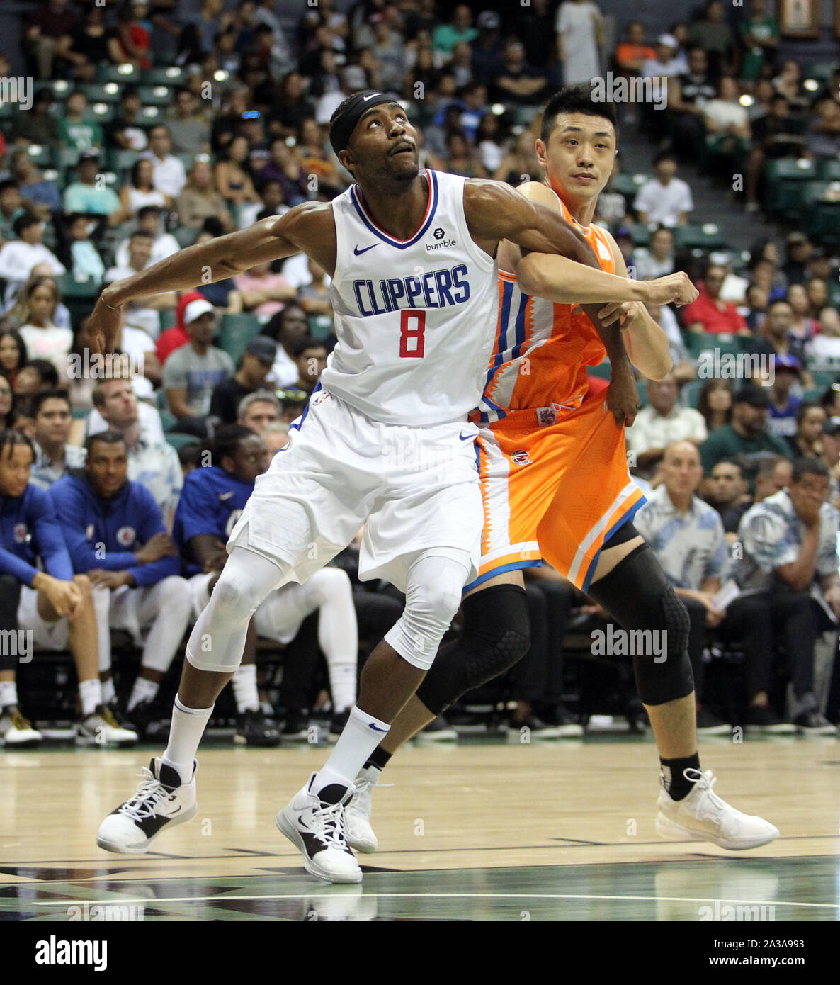 Honolulu, Hawaii. October 6, 2019 - Los Angeles Clippers forward Maurice Harkless #8 boxes out Shanghai Sharks forward Ju Mingxin #24 during a preseason game between the Los Angeles Clippers and the Shanghai Sharks at the Stan Sheriff Center on the campus of the University of Hawaii at Manoa in Honolulu, HI - Michael Sullivan/CSM. Stock Photo