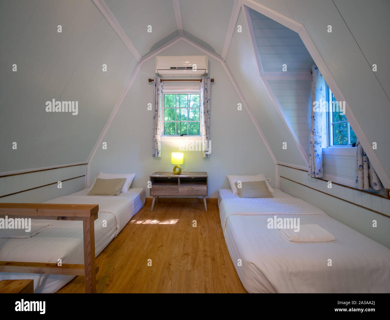 Modern styles of garret, a room under the roof, with two bead Stock