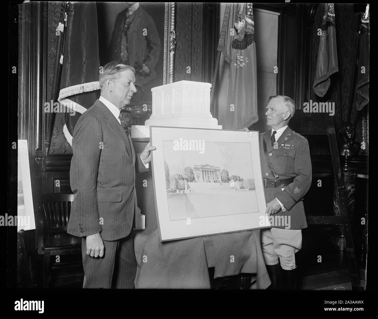 Secretary of War approves of design for Tomb of America's Unknown Soldier. The Secretary of War Dwight F. Davis (left) and Maj. Gen. B.F. Cheatham, Quartermaster General of the United States Army, inspecting the accepted design and model for the completion of the Tomb of the Unknown Soldier in Arlington National Cemetery, which was submitted by Thomas Hudson Jones, sculptor, of New York City; and Lorimer Rich, architect, also of New York City. This design was selected after a competition in which seventy-three designs were submitted Stock Photo