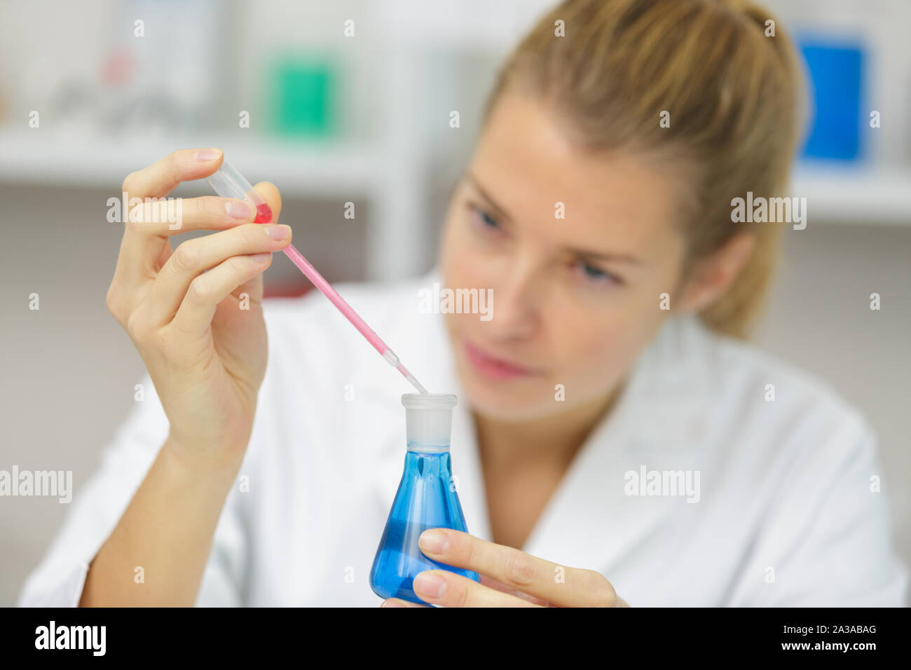 Woman during lab experiment hi-res stock photography and images - Alamy