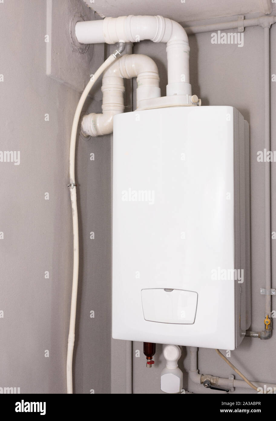 Furnace, Hot Water heater in a laundry room Stock Photo