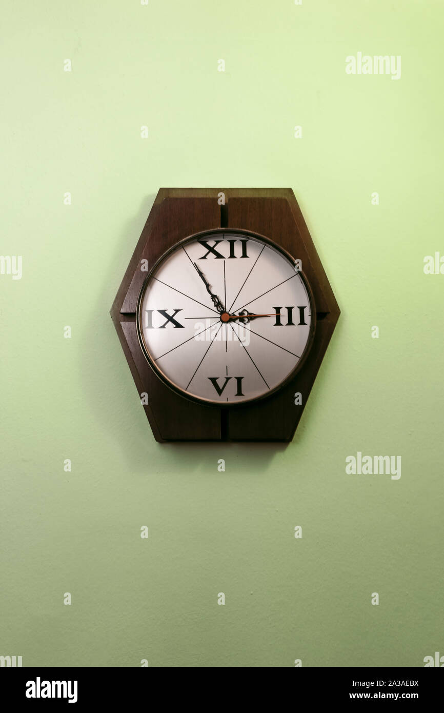 Old Stylish Clock Hanging On A Wall Stock Photo