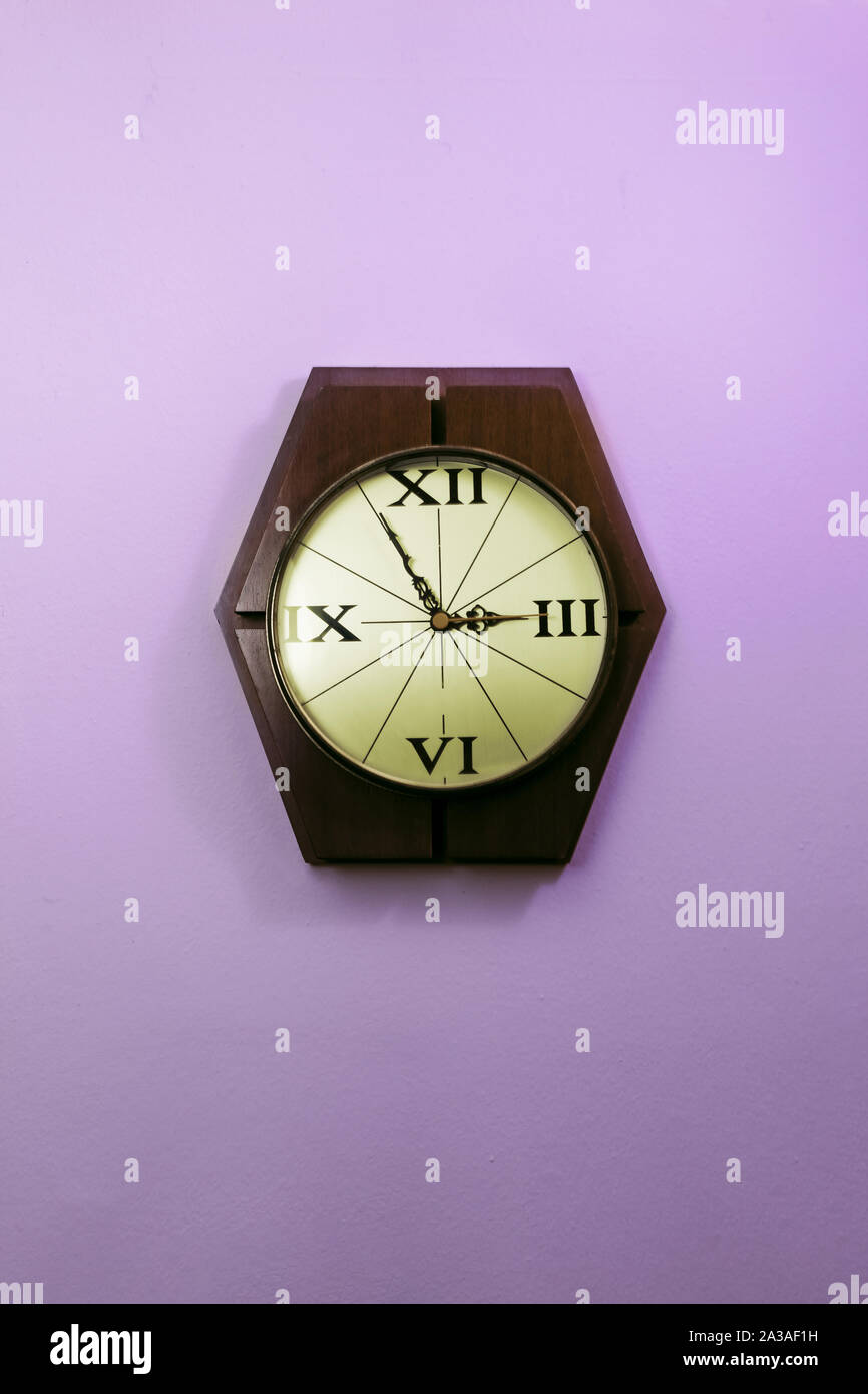 Old Stylish Clock Hanging On A Wall Stock Photo