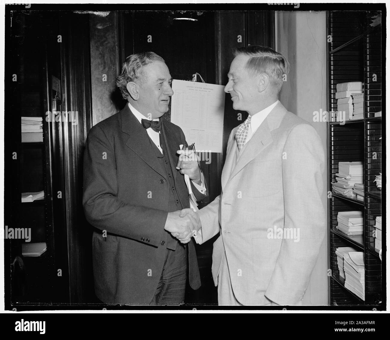 Senate Committee approves SEC head's proposal. Washington, D.C., March 30. A proposal by William O. Douglas, right, Chairman of the Securities and Exchange Commission, to exempt transfers of securities and properties by holding companies liquidating under the 'death sentence' clause of the Public Utility Holding Company Act from the capital gains tax, was approved today by the Senate Finance Committee. Douglas is pictured with Sen. Tom Connally as he arrived at the Capitol to appear before the committee Stock Photo