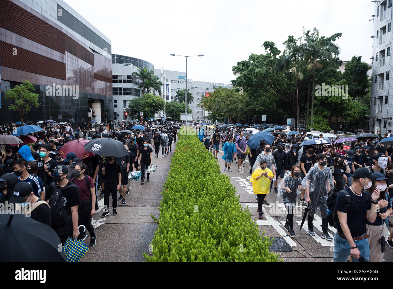 Hong Kong, China. 06th Oct, 2019. Protesters walk through the streets during the demonstration.Protesters marched through various districts in Hong Kong in the latest round of protests. While the demonstration began peacefully, riot police arrived later on to conduct a dispersal operation, resulting in several arrests. Anti-government protesters continue to make their '5 demands' heard as they continue to defy government and police warnings week after week. Credit: SOPA Images Limited/Alamy Live News Stock Photo