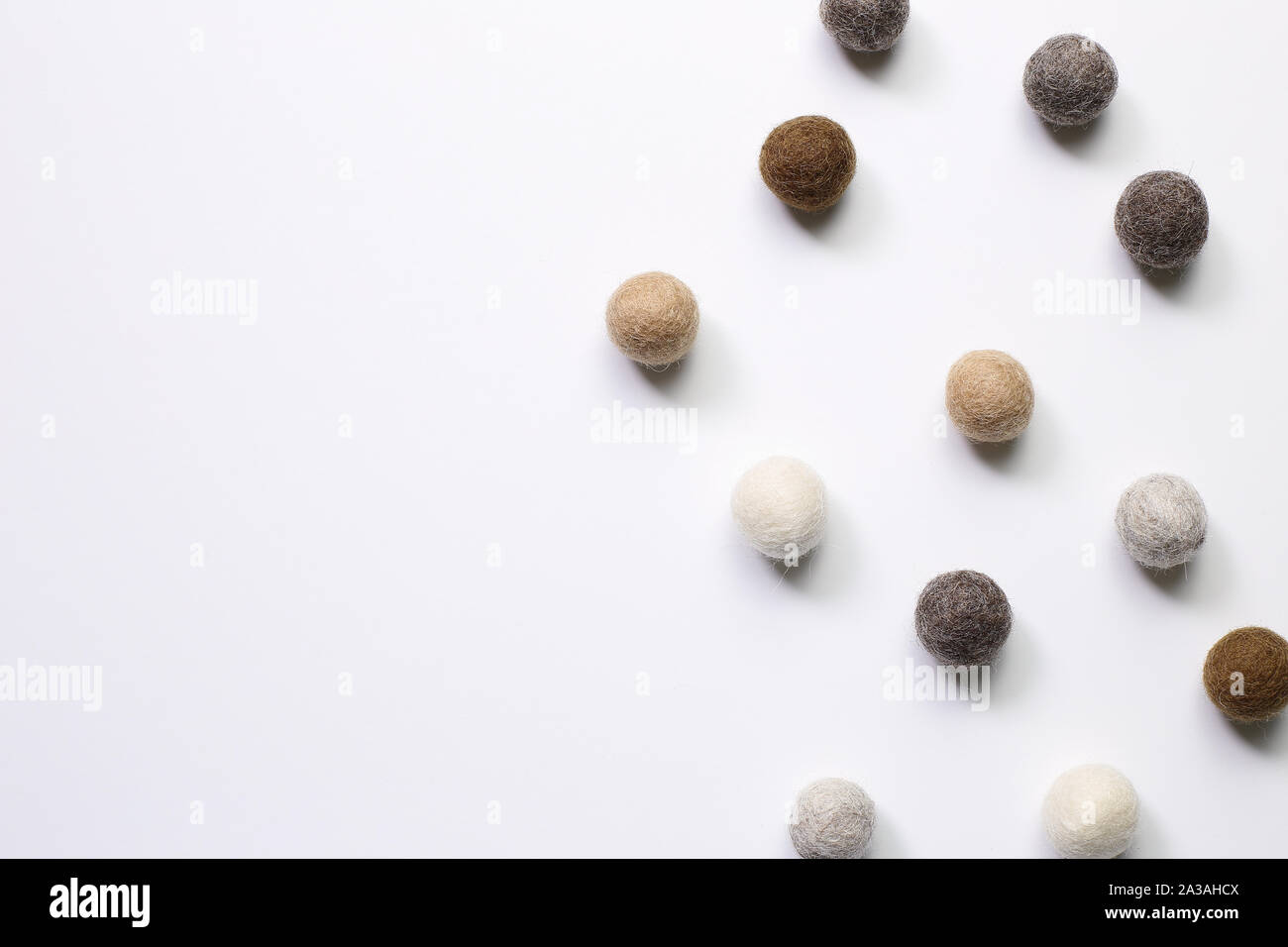 Knitted balls on white background. Winter decoration Stock Photo