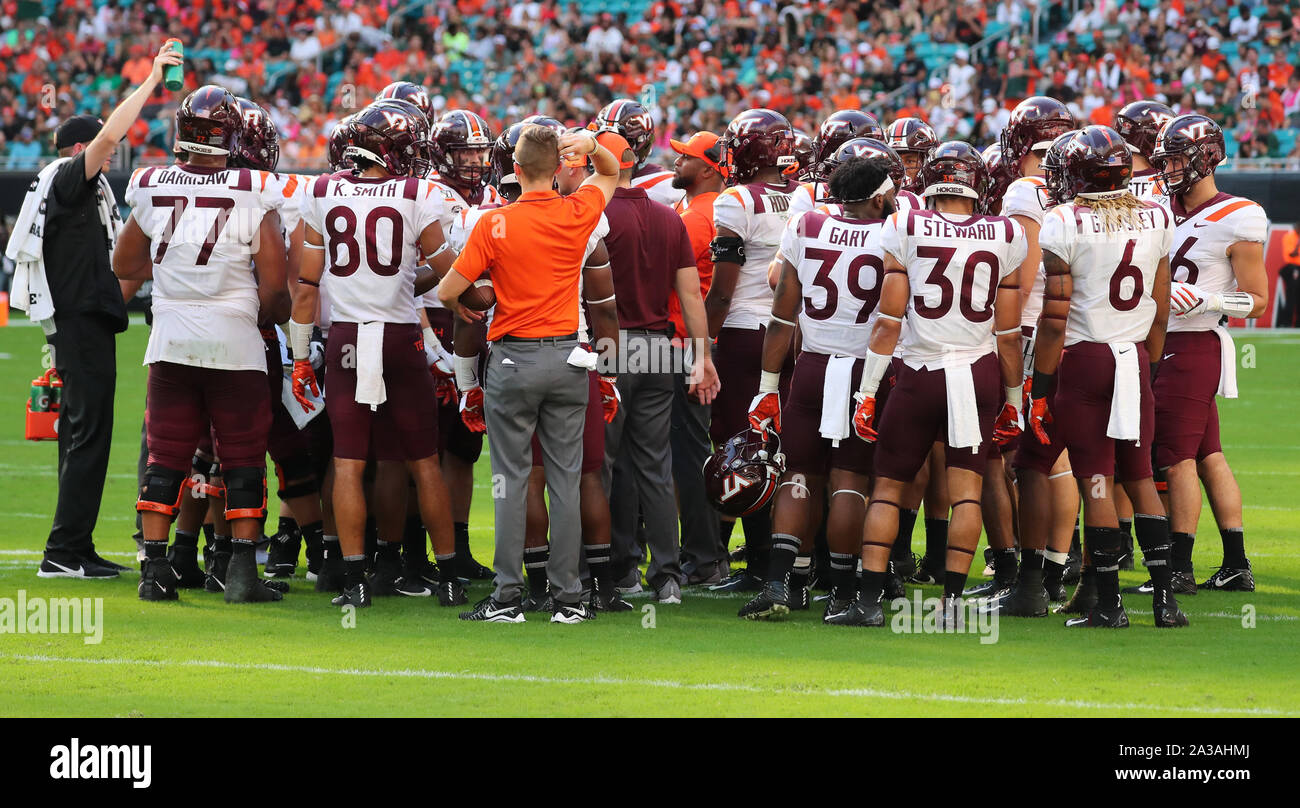 Miami Gardens, Florida, USA. 05th Oct, 2019. A group of Virginia Tech Hokies players gather on the field during a timeout during the college football game against the Miami Hurricanes at the Hard Rock Stadium in Miami Gardens, Florida. Virginia Tech won 42-35. Mario Houben/CSM/Alamy Live News Stock Photo