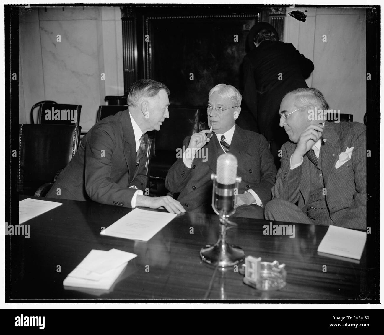 Senatorial old timers. Washington, D.C., April 17. Three senators whose terms have successfully brought them back to the U.S. Senate are these who were photographed at the Neutrality Hearings of the Foreign Relations Hearing today. Left to right: Senators Key Pittman, Chairman of the Committee, Hiram Johnson of California, and Arthur Vandenberg of Michigan Stock Photo