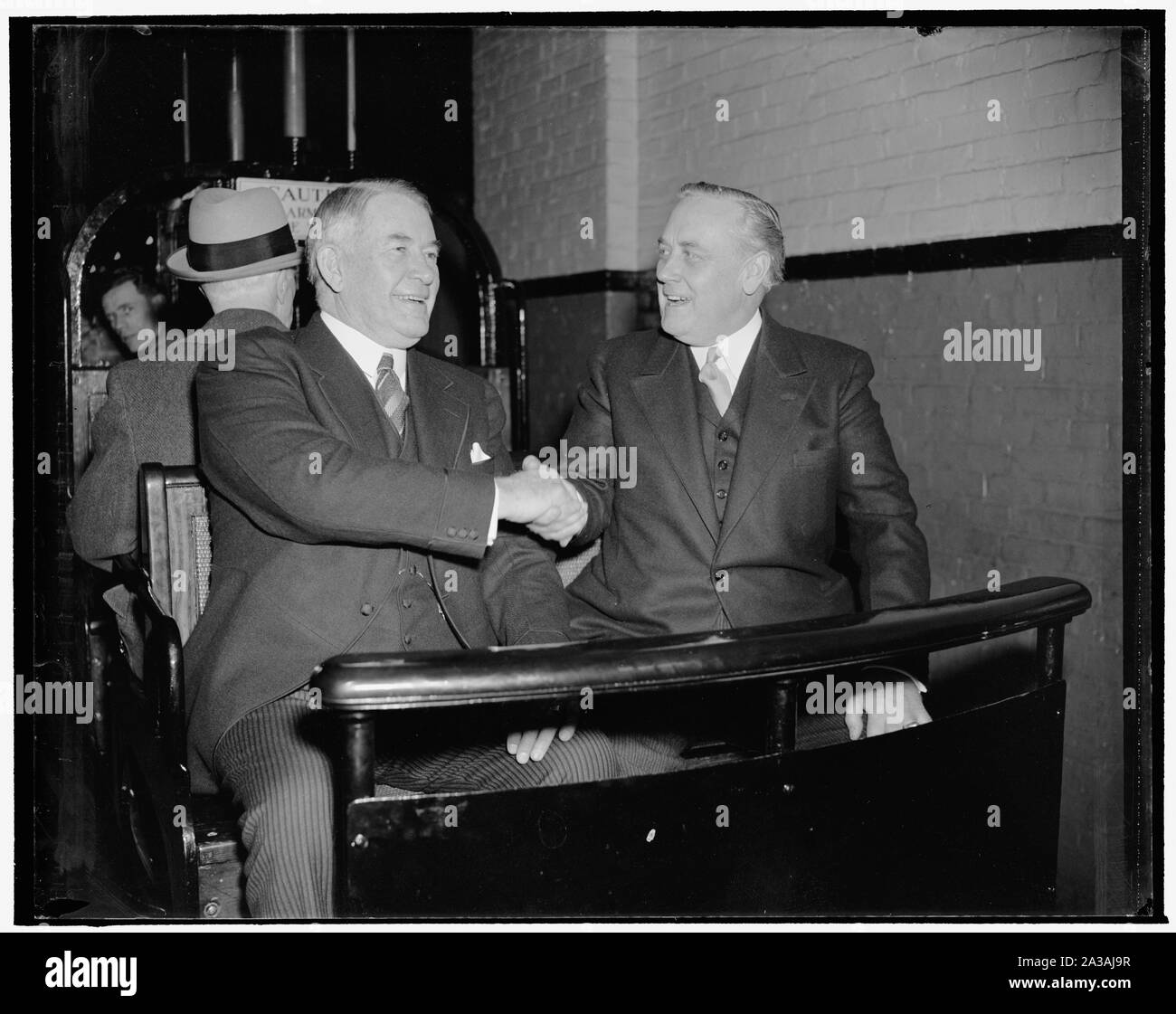 Senators in jovial mood as they arrive for opening session of new Congress. Washington, D.C., Jan. 3. Senate Majority Leader Alben W. Barkley, left, and Senator Alexander Wiley, Republican of Wisconsin, seemed happy that the new session of Congress would convene today as they rode the Senate subway for the Capitol Stock Photo