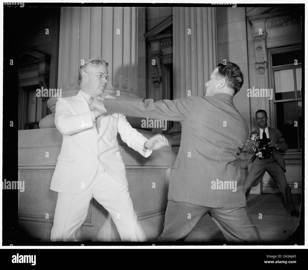 Senators in playful mood. Washington, D.C., June 15. It wasn't all work and no play for all of the Senators today as the Senate pushed through last minute bills to speed adjournment. Senator F. Ryan Duffy, (left) Wisconsin, engages in a sparring match with Senator Allen Ellender, Louisiana, as their colleagues debated the conference report on the $375,000,000 flood control bill, 6/15/38 Stock Photo