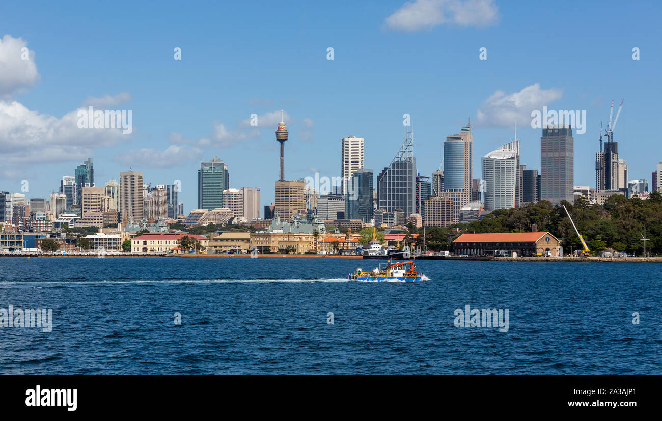 Floating crane at sea against iconic Sydney skyline in Sydney Harbour, Sydney, Australia on 27 September 2019 Stock Photo