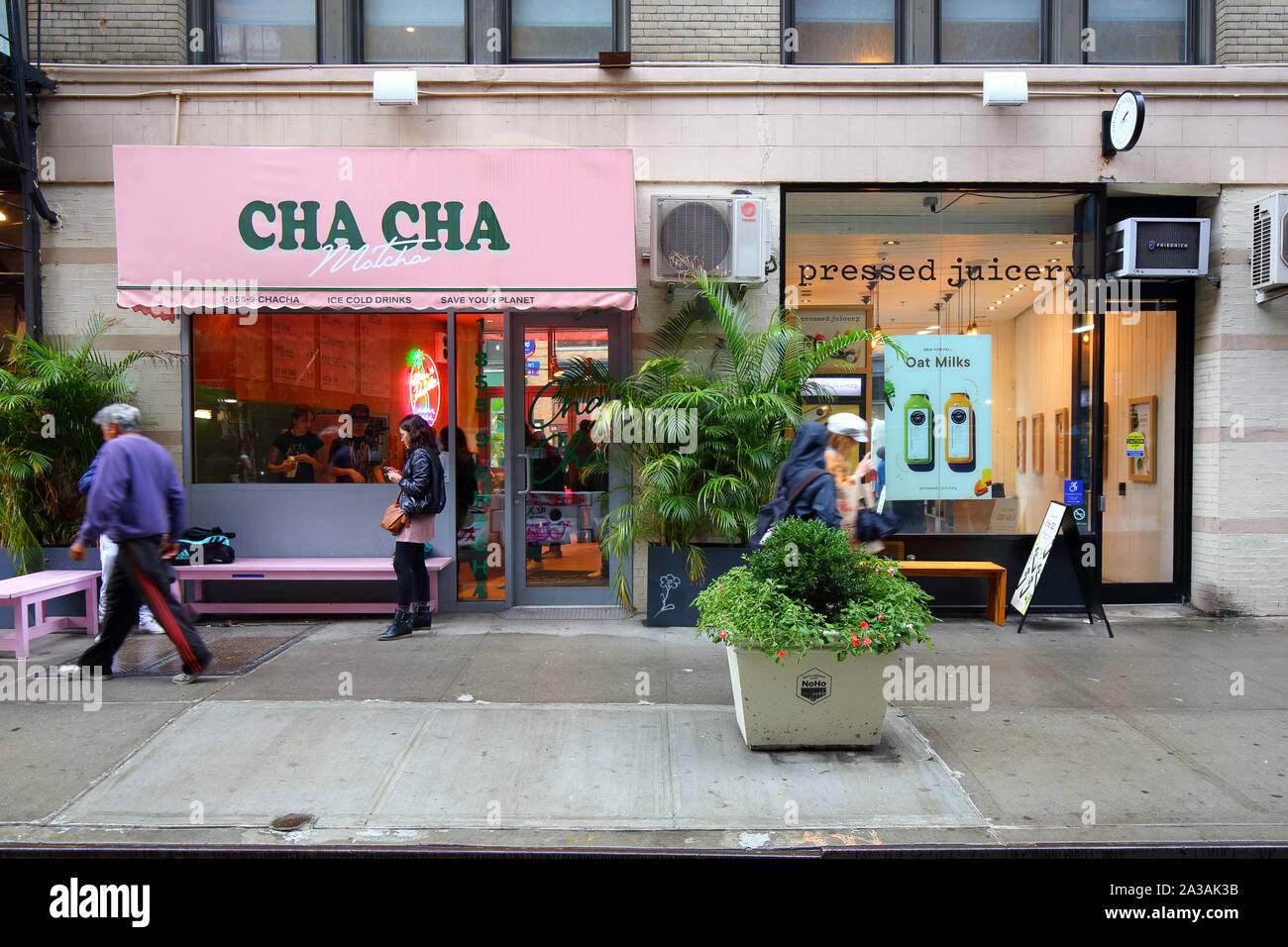 Cha Cha Matcha, Pressed Juicery, 327-329 Lafayette Street, New York, NY. exterior storefront of cafes in the NoHo neighborhood of Manhattan. Stock Photo