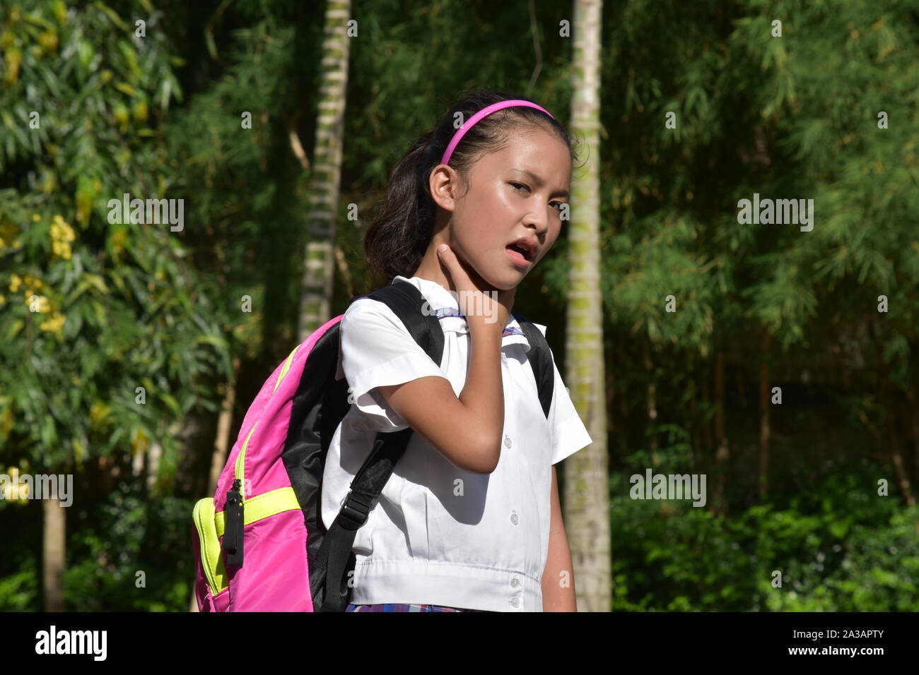 Female Student With Sore Throat Wearing School Uniform Stock Photo Alamy