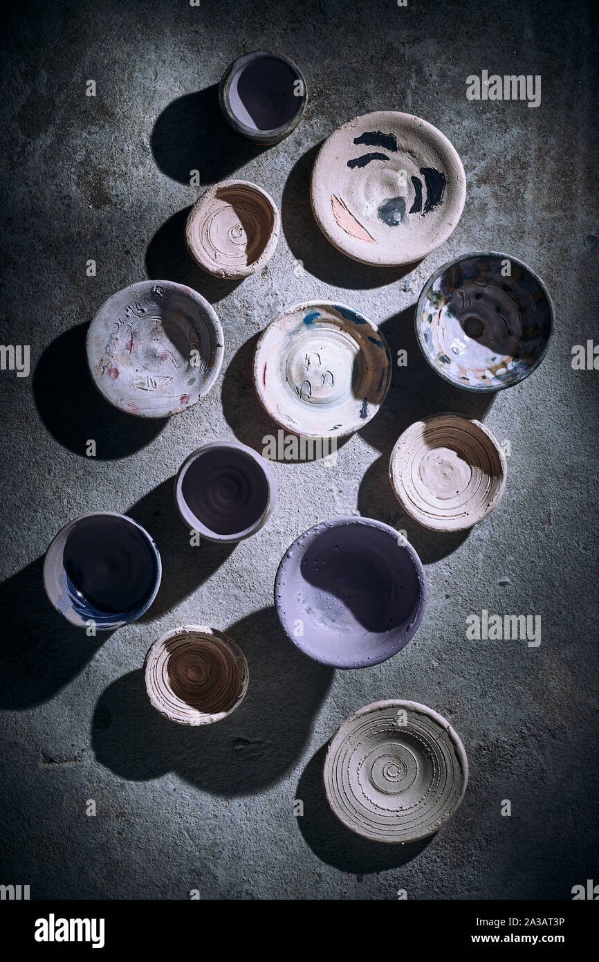 Different handmade ceramic on background. Stock Photo