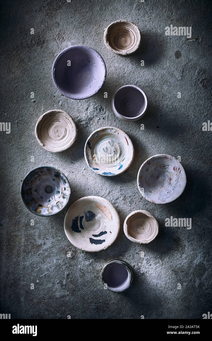 Different handmade ceramic on background. Stock Photo