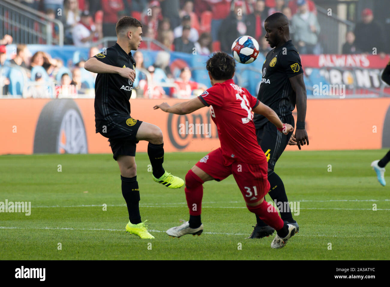 Toronto, Canada. 06th Oct, 2019. Wil Trapp (L), Jonathan Mensah (R) and Tsubasa Endoh (M) in action during the MLS (Major League Soccer) game between Toronto FC and Columbus Crew SC. Final Score: Toronto FC 1 - 0 Columbus Crew SC. Credit: SOPA Images Limited/Alamy Live News Stock Photo
