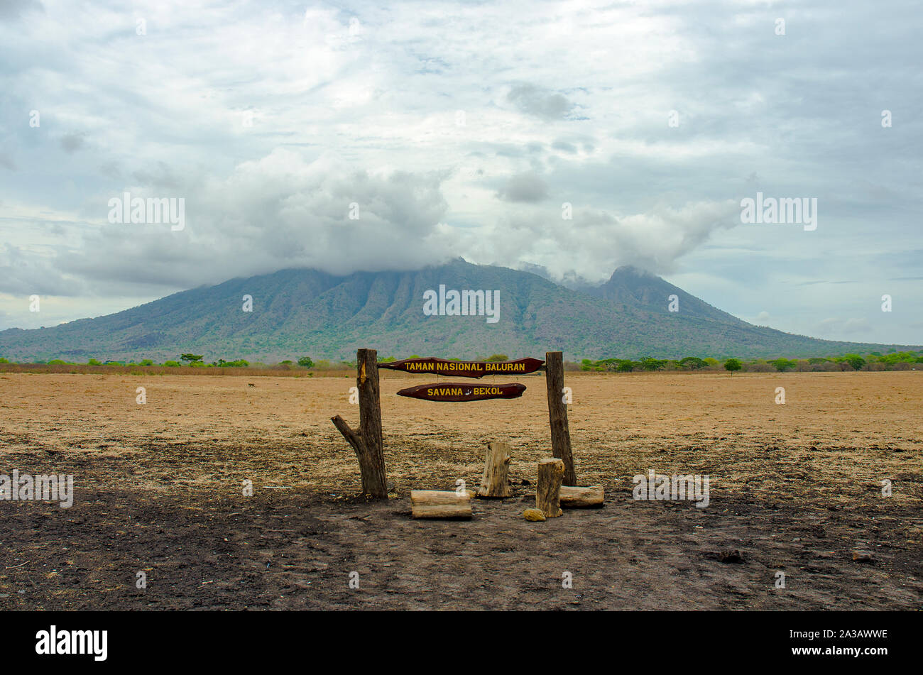Sign board at Baluran National Park with Mount Baluran in the background, Situbondo, East Java, Indonesia Stock Photo